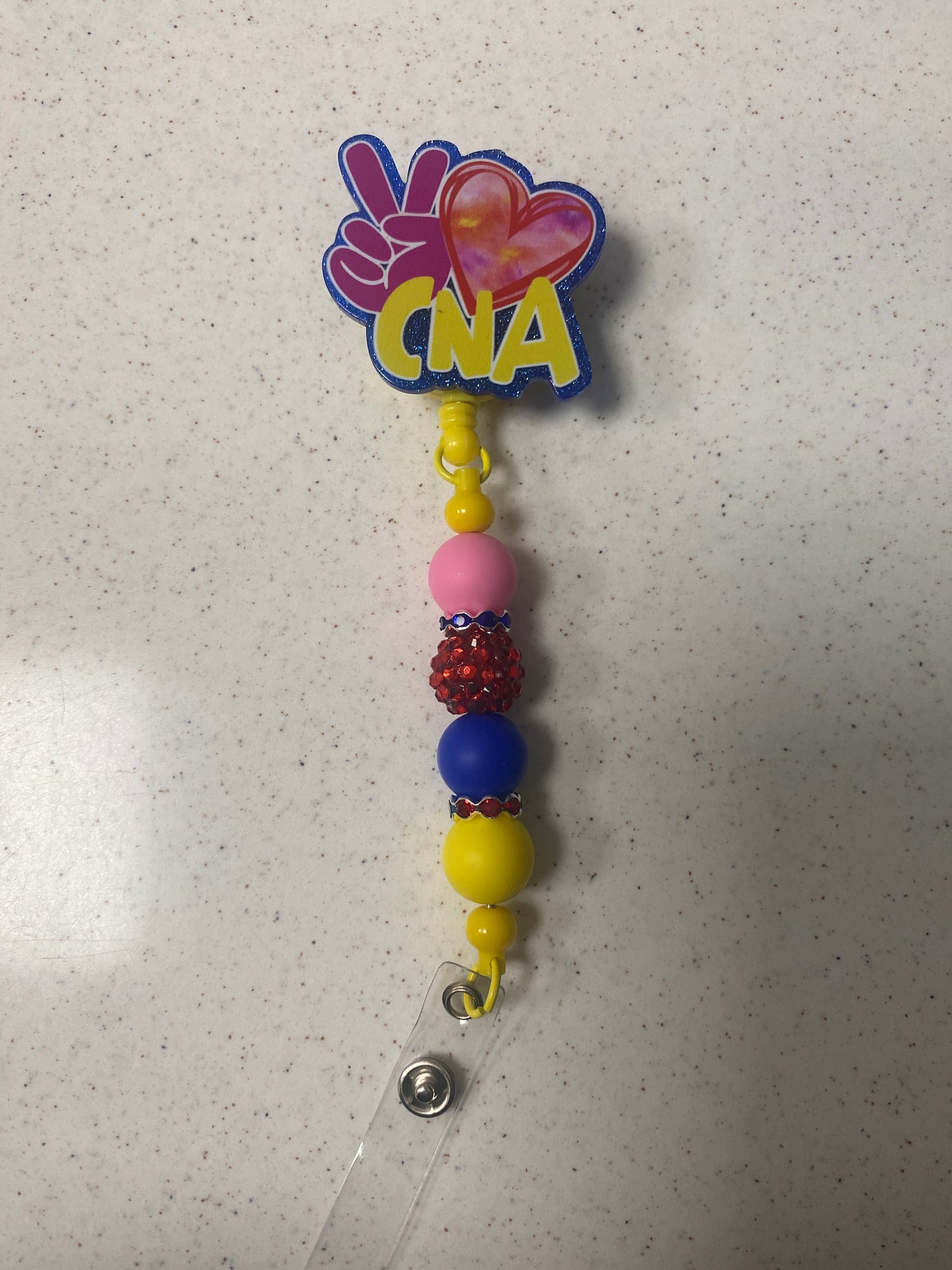 Peace sign cna beaded badge reel