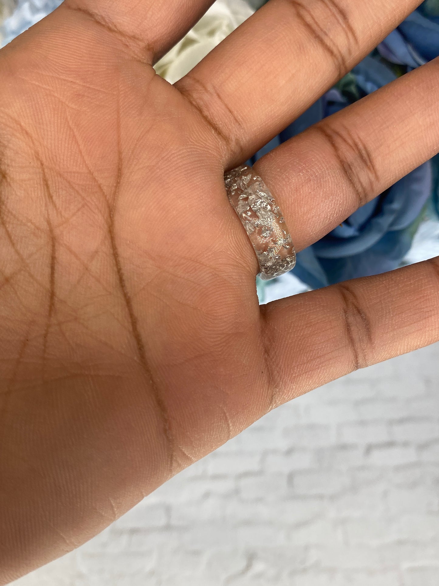 Clear acrylic ring with silver glitter specs