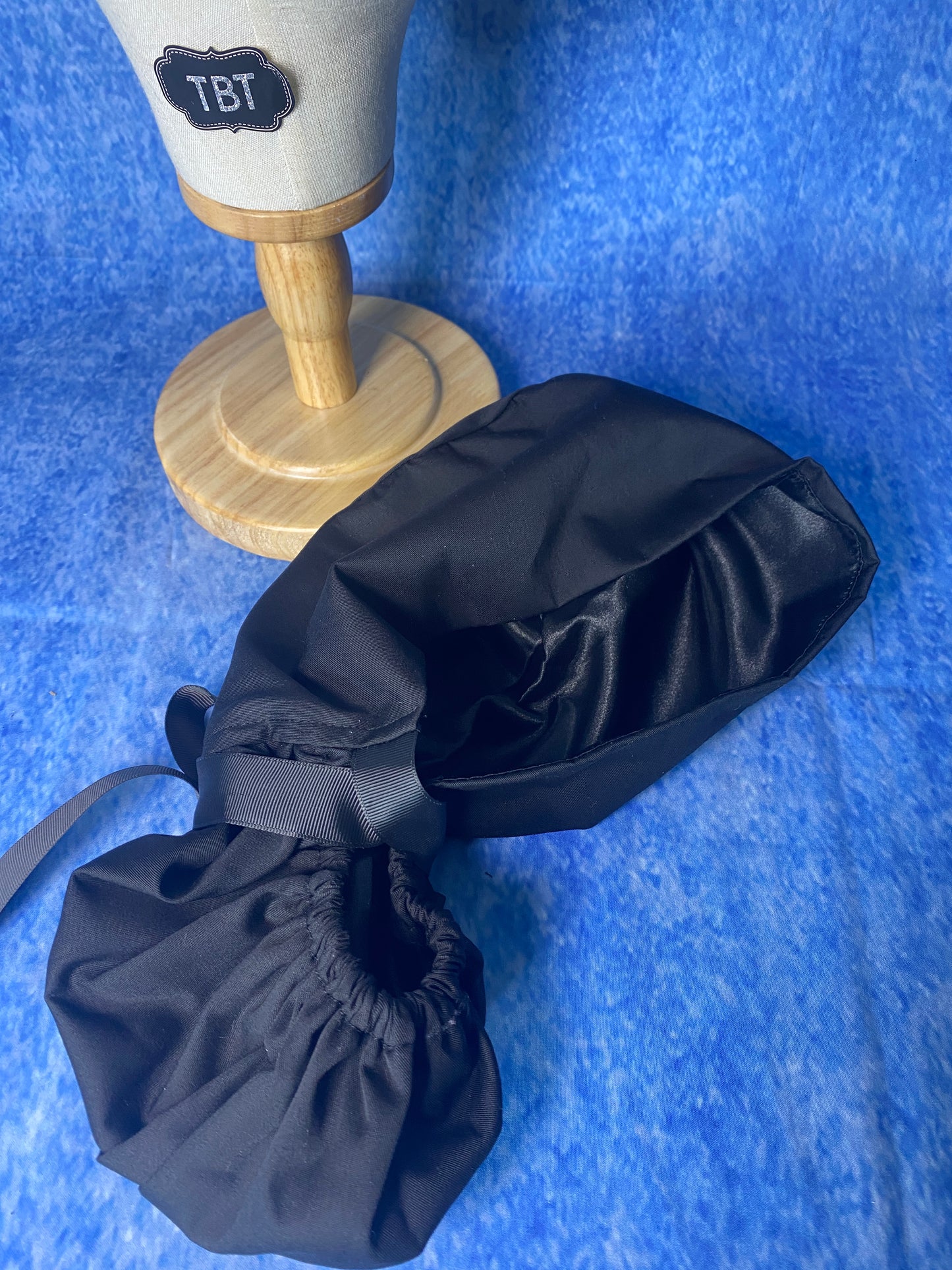Black satin lined surgical scrub cap