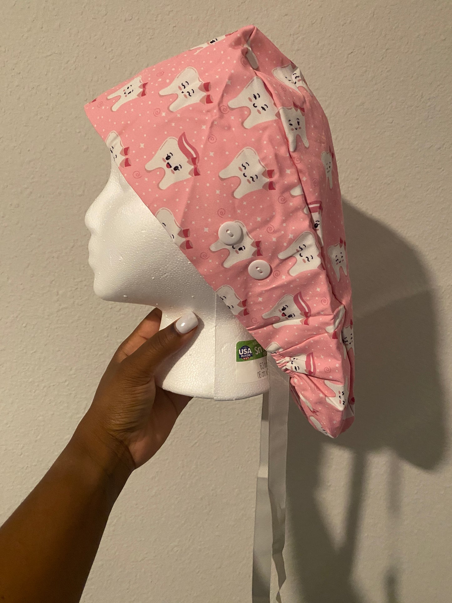 Pink satin lined tooth hat