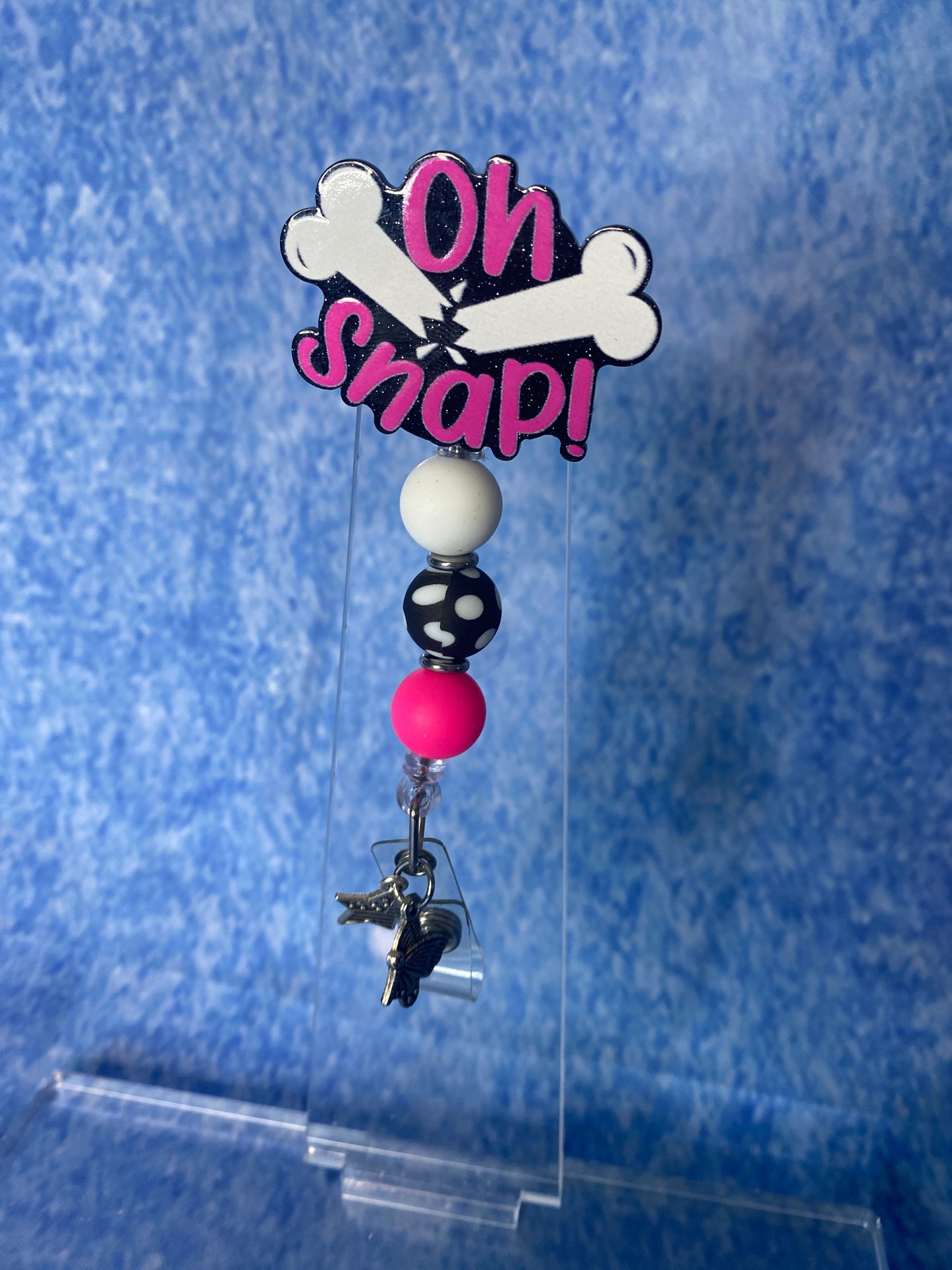 On snap pink black and white badge reel