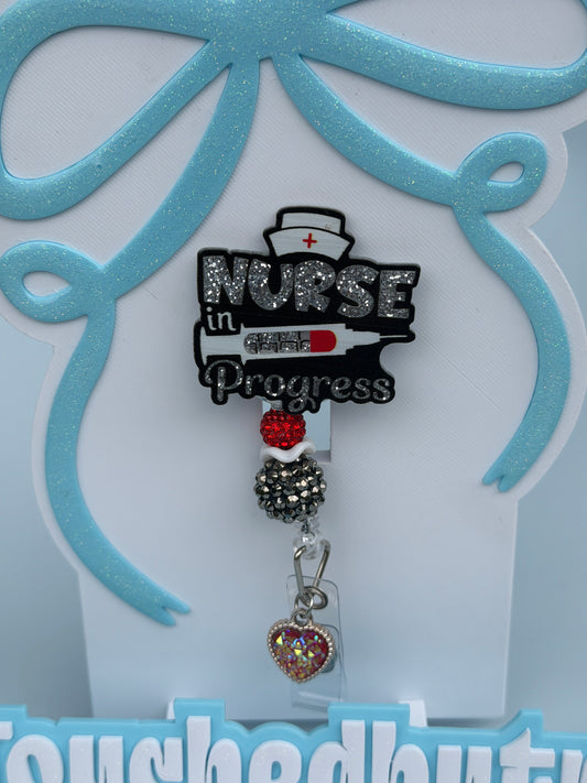 Nurse in progress badge reel, red black and white