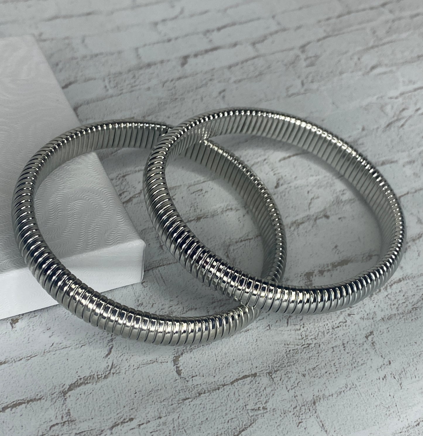 Thick stretch silver plated bangles (2 pieces)