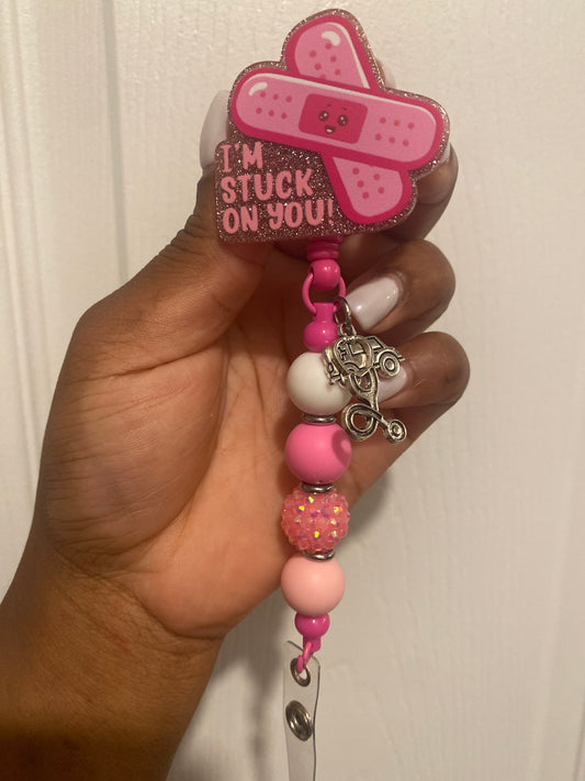 Pink/ white rn badge reel Stuck on you