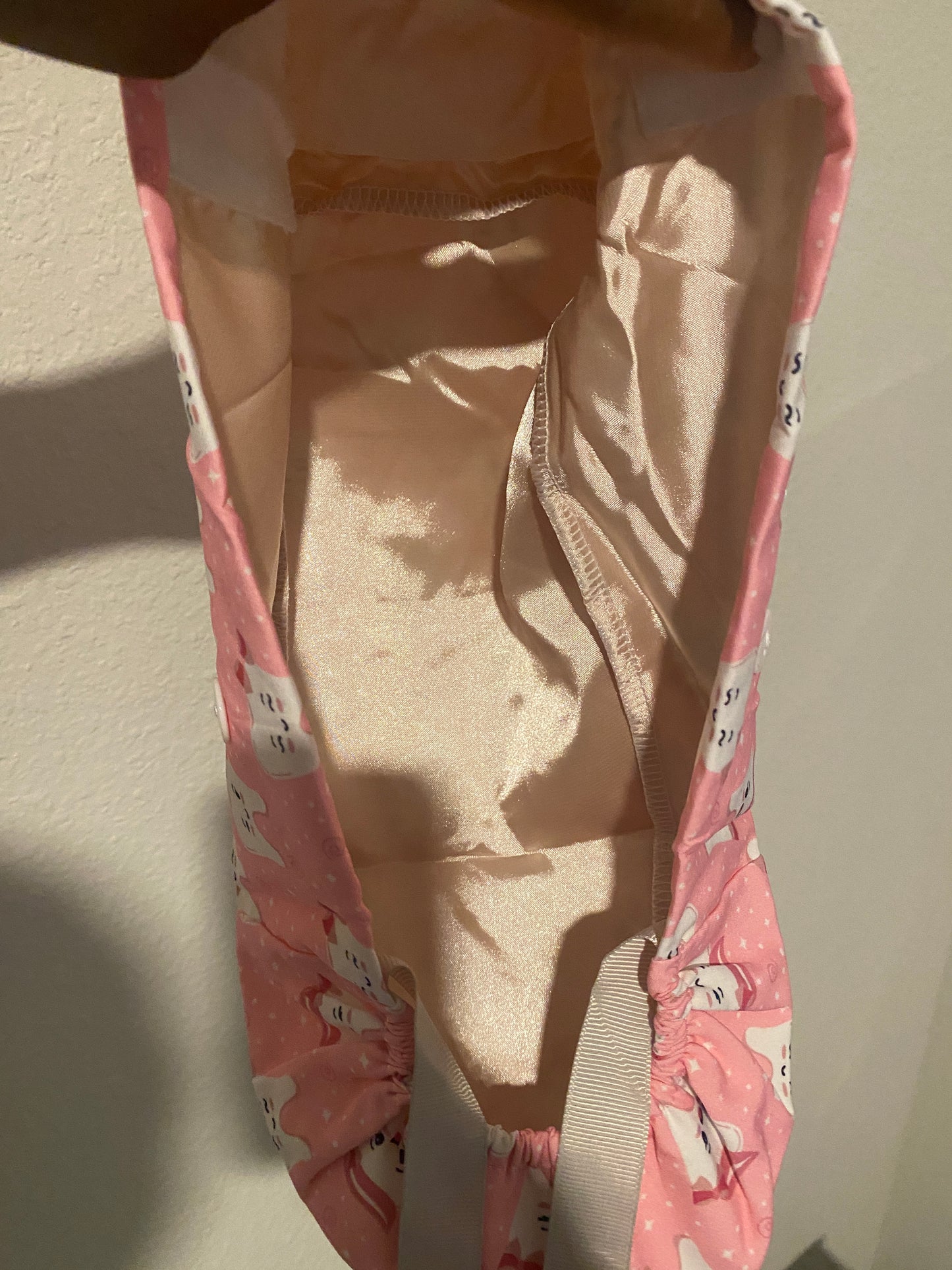 Pink satin lined tooth hat