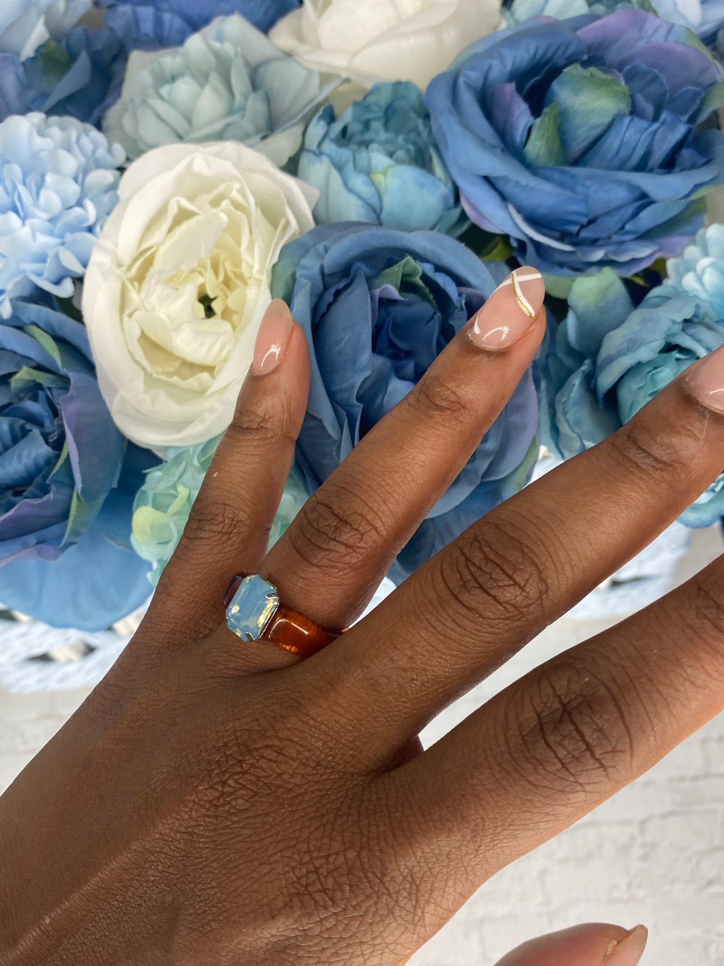 Brown acrylic ring with light blue stone