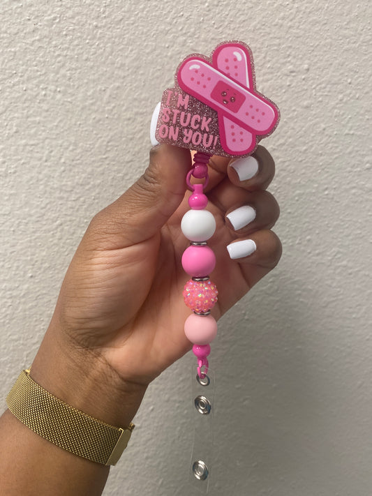 Pink/ white rn badge reel Stuck on you