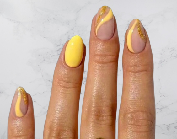 Nude and yellow almond shaped acrylic nails