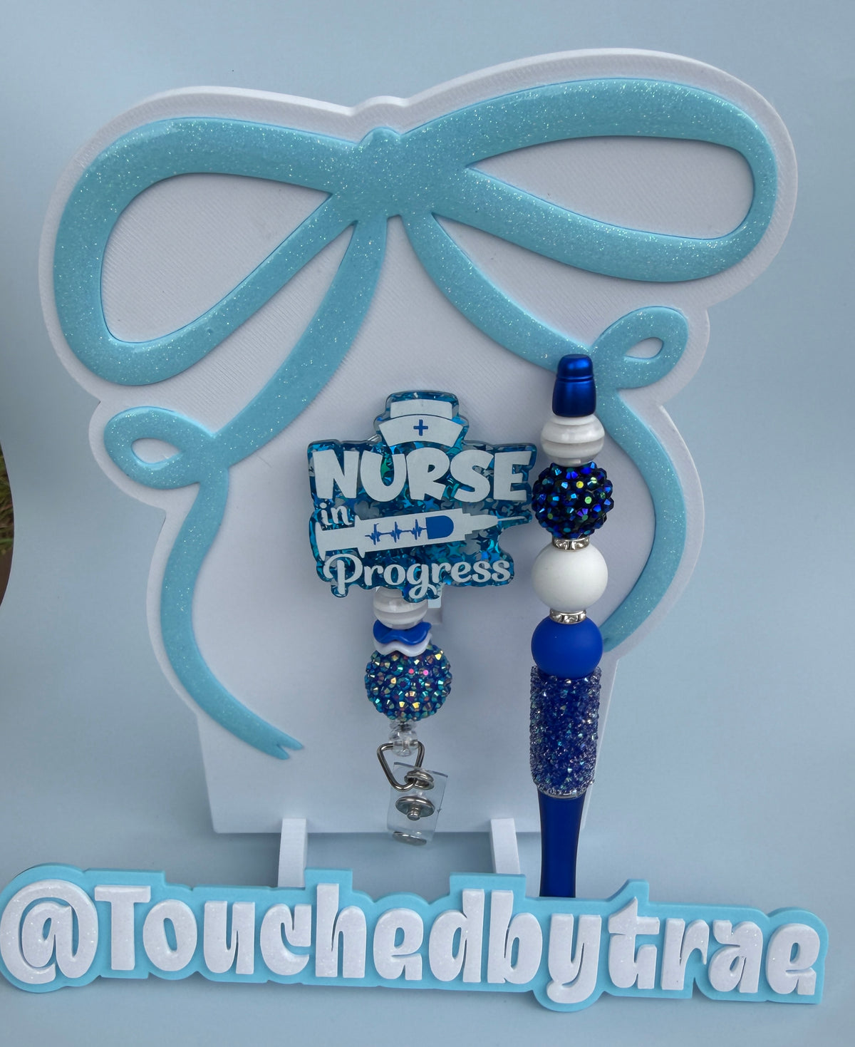 Blue rn badge reel and pen