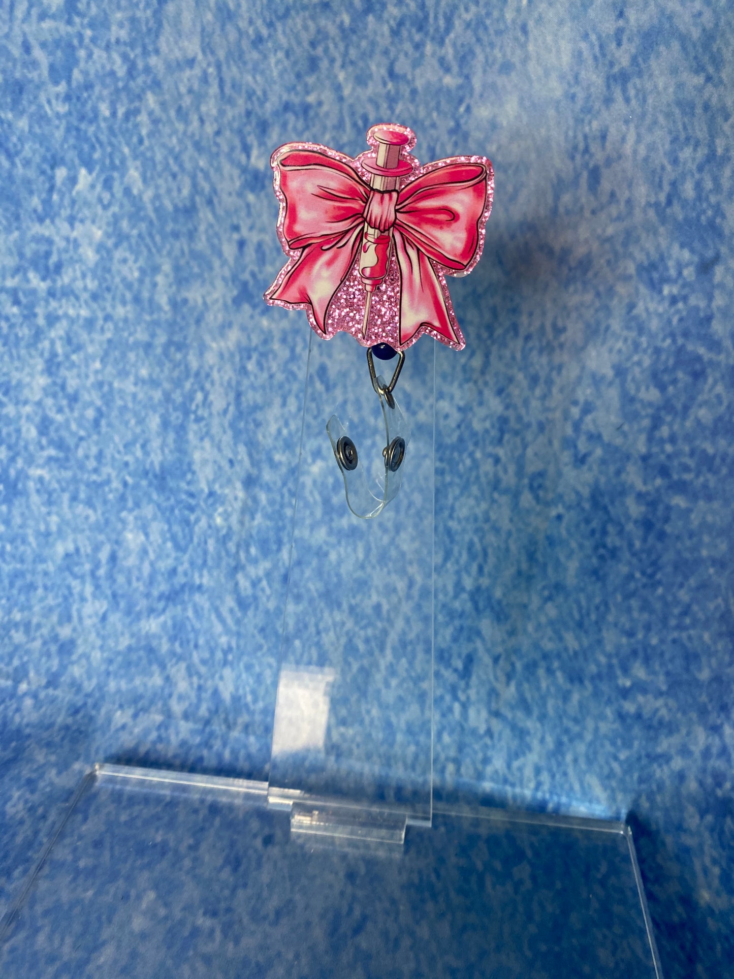 Pink bow badge reel